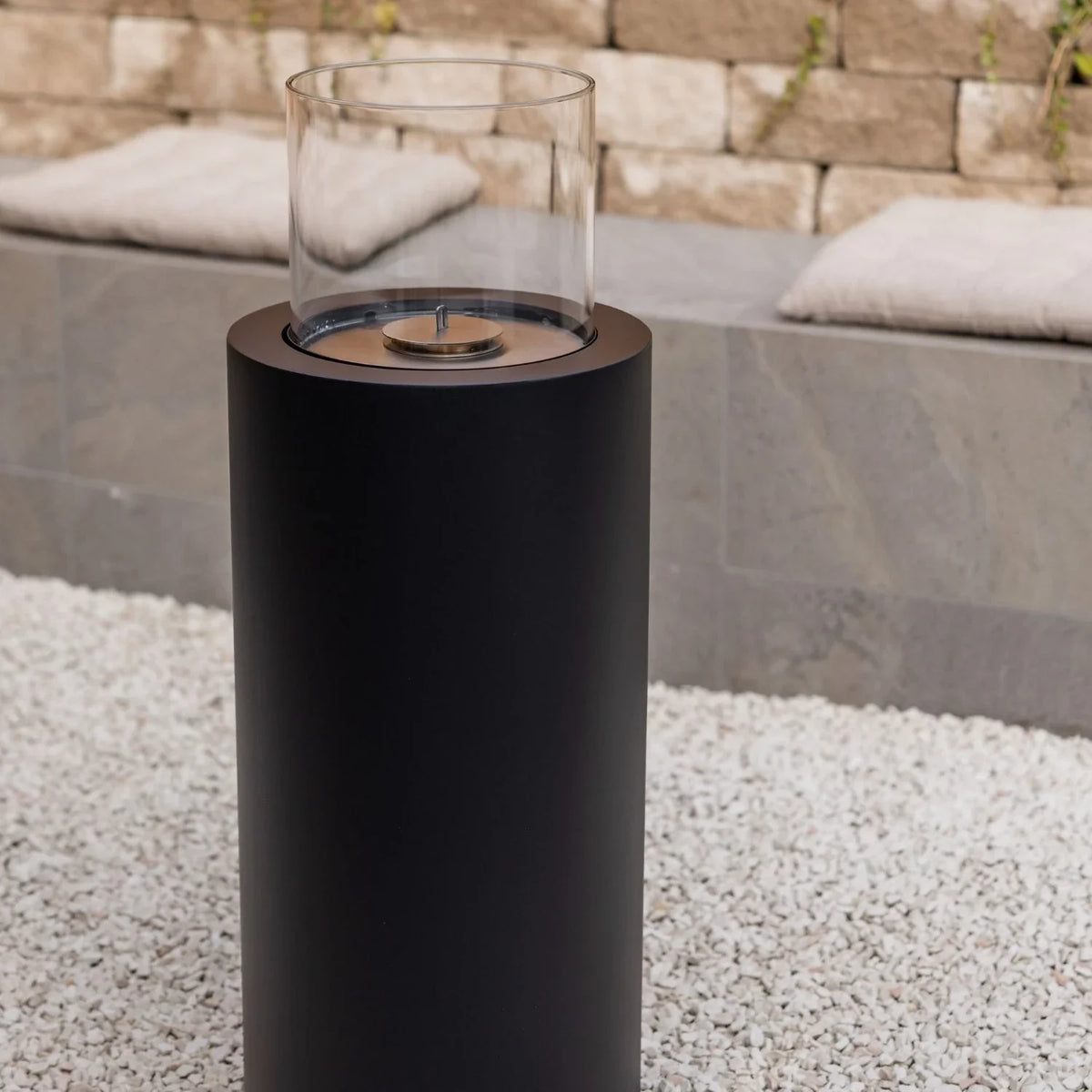 Close-up of the ScandiFlames Dualis Black burner and glass windguard