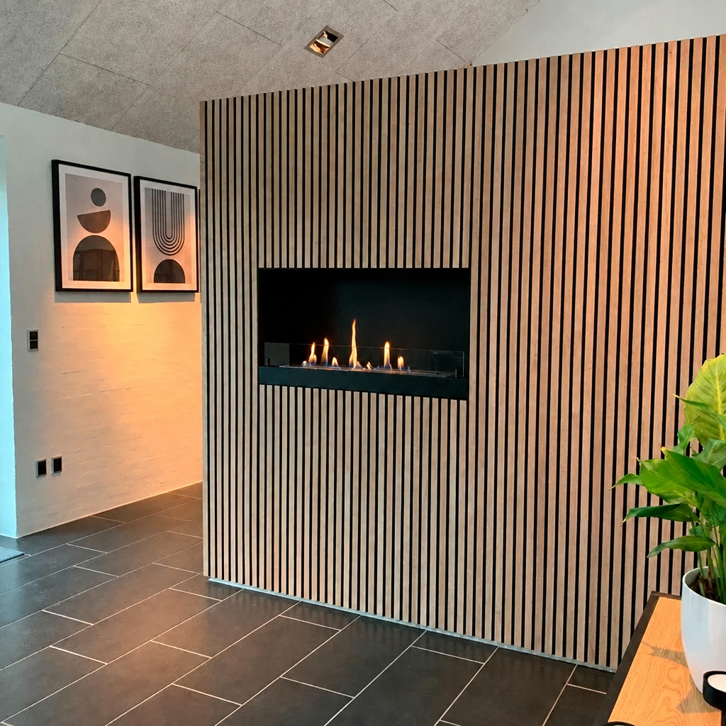 ScandiFlames 100cm built-in bioethanol fireplace installed on a slatted wood panel wall, lit with a slightly taller realistic flame
